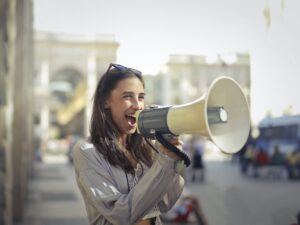 Girl shouting on a microphone