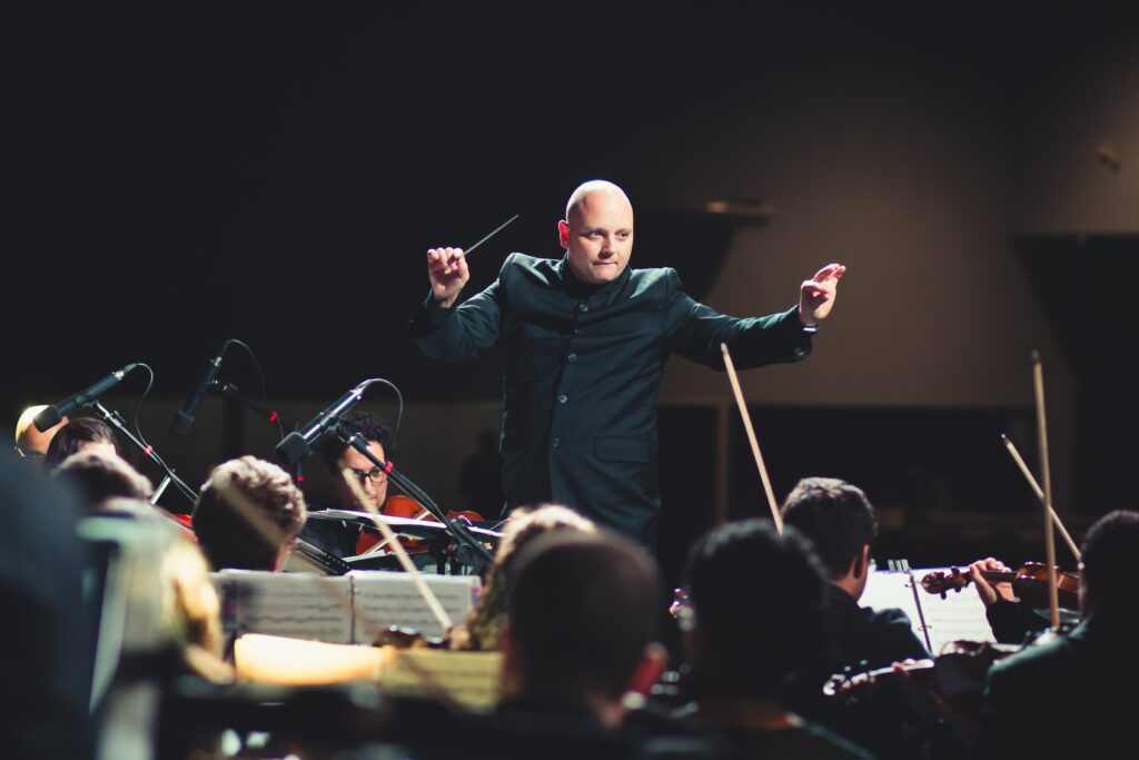 A person directing symphony orchestra